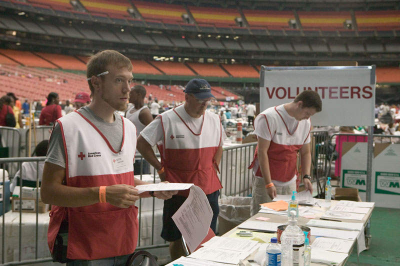 Volunteers assist Hurricane victims at the Houston Astrodome, following Hurricane Katrina.