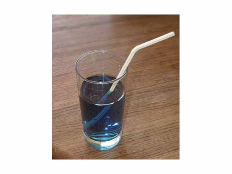 The straw seems to be broken, due to refraction of light as it emerges into the air.