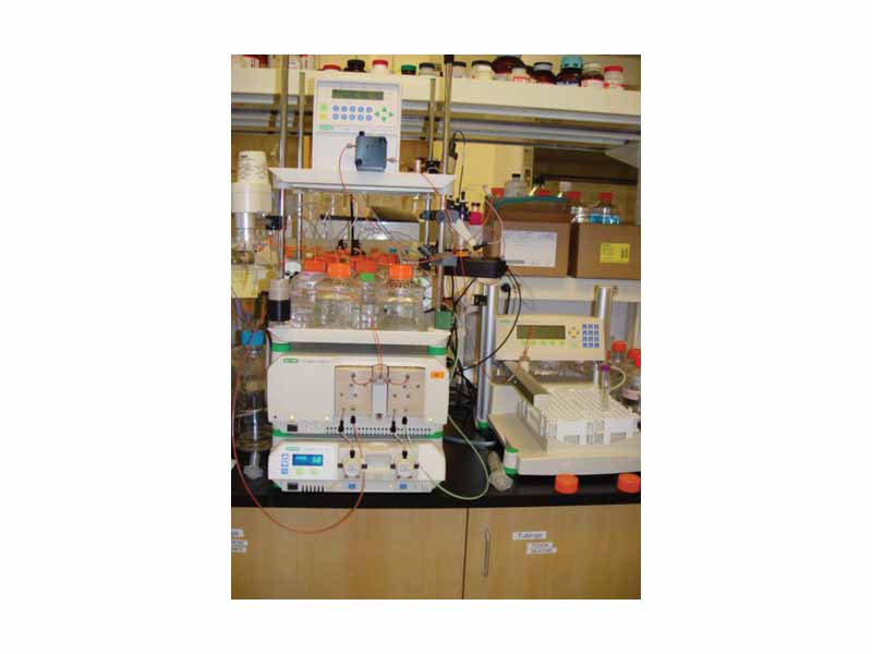 Equipment for running size exclusion chromatography. The buffer is pumped through the column (right) by a computer controlled device